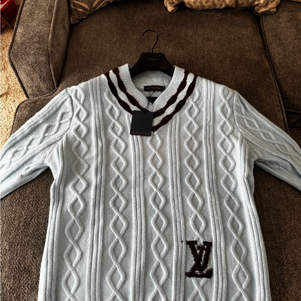 Light Blue Sweater with V-Neck Detailing